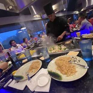 a group of people eating at a restaurant