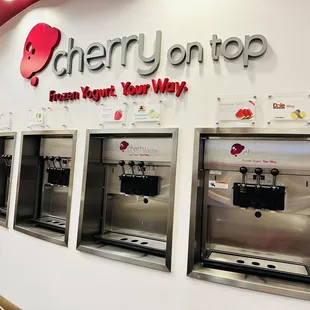 a row of frozen yogurt machines