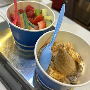a bowl of ice cream and a bowl of fruit