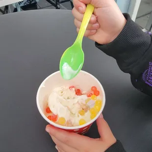 a child eating a bowl of ice cream