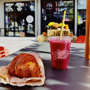  a croissant and a smoothie
