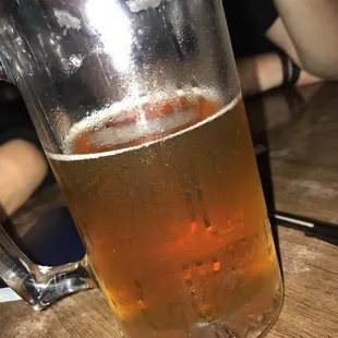 a glass of beer on a table