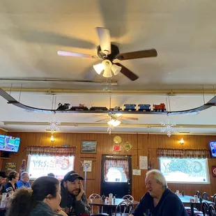 Haven&apos;t seen a place with a suspended train in forever! PS: ask about the mini stoplight on the back wall for some local history!