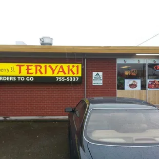 a car parked in front of a restaurant