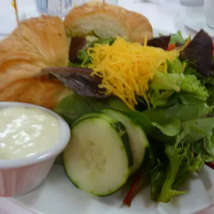Chicken Salad Sandwich on croissant with green side salad