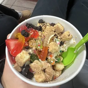 a person holding a bowl of food