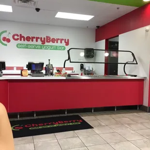 a woman standing in front of a counter