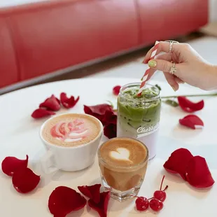 two cups of coffee and rose petals