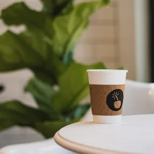 a cup of coffee on a table