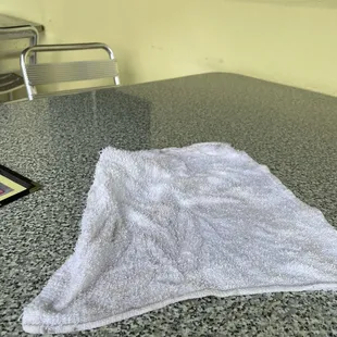 Dirty ass towel I was given to clean my own table and chairs with