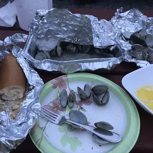 a plate of clams on a picnic table