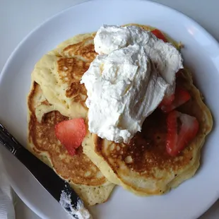 Pancakes with strawberries and fresh cream