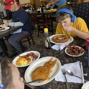 Kids breakfast with pancake. Half order cinnamon roll french toast with bacon.