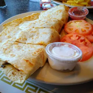 Chicken Quesadilla--covers a full dining plate; tomatoes substituted for fries