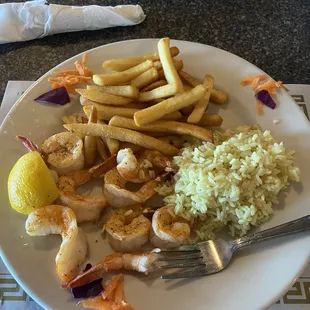 Broiled Shrimp with rice pilaf and French fries