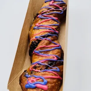 a donut with pink and blue icing