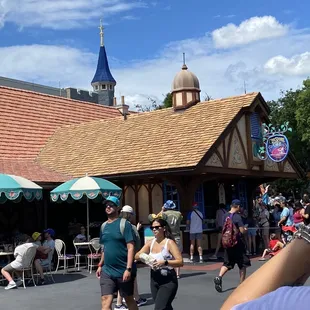 people walking in front of cheshire cafe