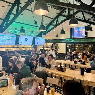 a large group of people eating and drinking