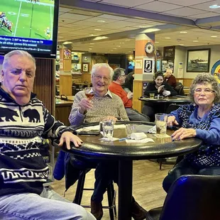 a group of people sitting at a table