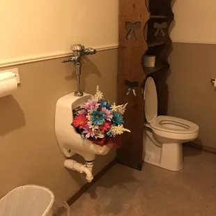 Now that's an awesome way to add a woman's touch to the lady's room.