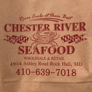 a brown paper bag with a crab on it