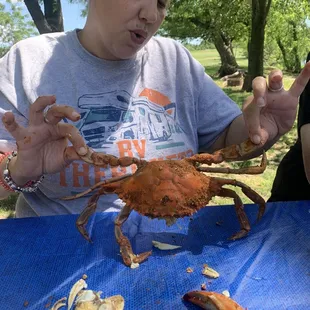 a woman eating a crab