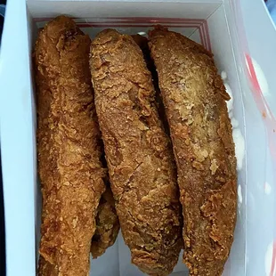 a close up of a basket of fried chicken
