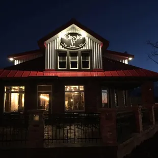 the front of the restaurant at night