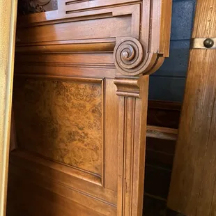 Wood bedframe detail.. look at those classical elements and workmanship!