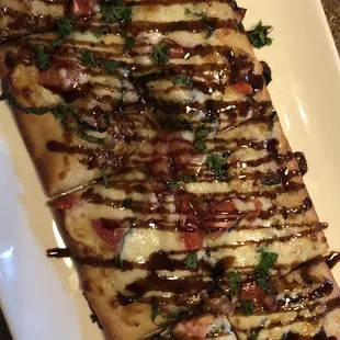 a flatbread pizza on a plate