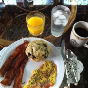 Fresh baked muffin, crisp Iowa baco, eggs with fresh herbs and garden tomatoes, and coffee, tea and juice!