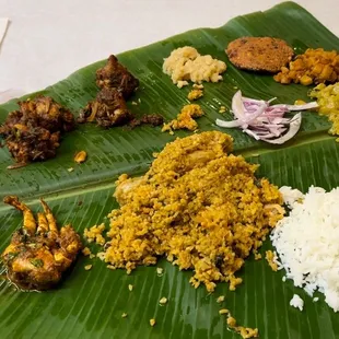 a banana leaf with rice