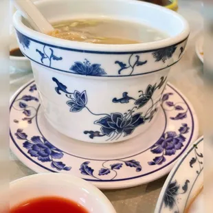 a bowl of soup with a spoon in it