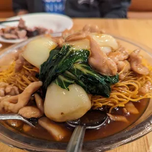 Chicken bok choy sauce over pan fried noodles