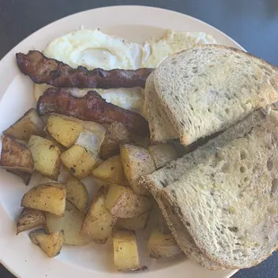 2 eggs, bacon, potatoes, and toast.