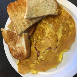 ham-and-cheddar omelet. Covered in some type of batter or something.