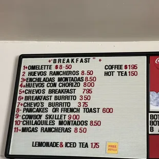 a menu and prices on the wall
