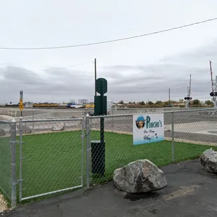 Enclosed area for dogs to walk and poop.