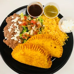 Empanada stuff with choice of meat and melted cheese inside.