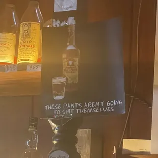 bottles of liquor and a sign