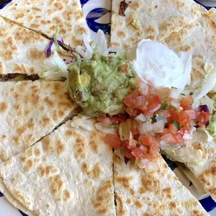 Steak quesadilla with guacamole, sour cream and pico de gallo