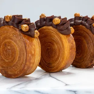 three pastries on a marble table