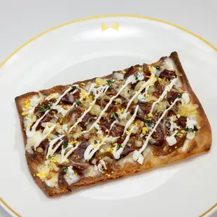 a piece of pizza on a plate