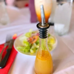 a salad and a bottle of dressing