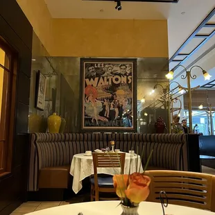 a dining area with tables and chairs