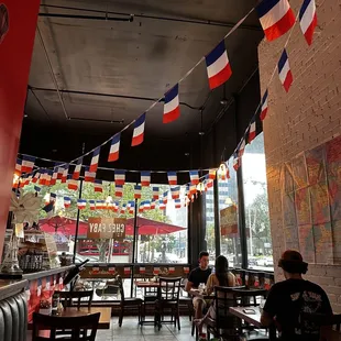 people sitting at tables in a restaurant