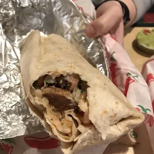 Fajita burrito. We recommend ordering the guacamole and the salsa on the side. Or else the tortilla will get soggy.