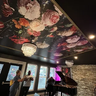 a woman playing a grand piano