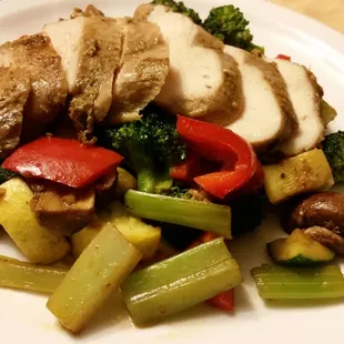 Baked chicken breast with sauteed zucchini, squash, celery, and sweet peppers