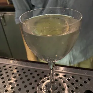 a glass of water on a bar